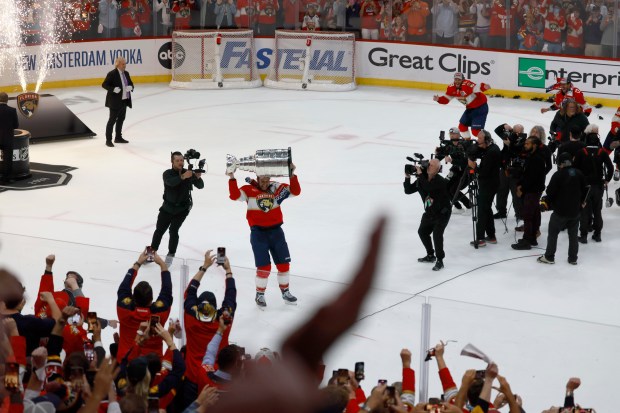 Florida Panthers center Aleksander Barkov (16) hoists the Stanley Cup...