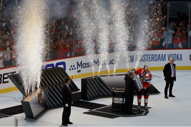Florida Panthers center Aleksander Barkov (16) is presented with the...