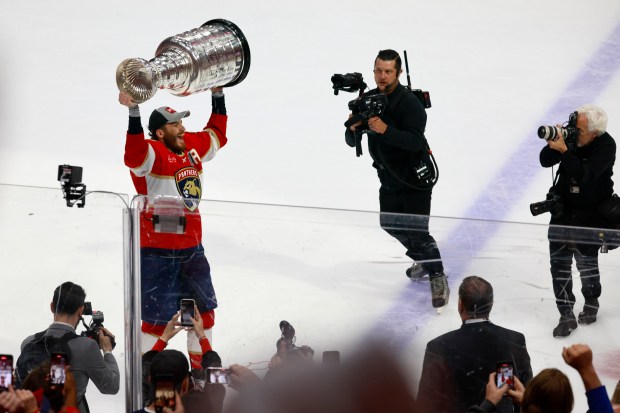 Florida Panthers left wing Matthew Tkachuk (19) hoists the Stanley...