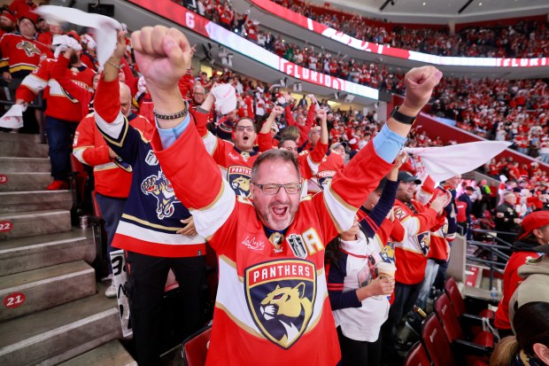 Fans celebrate after the Florida Panthers score the first against...