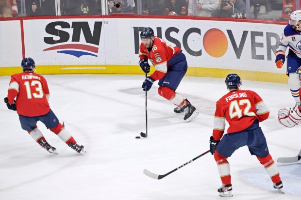 Florida Panthers center Aleksander Barkov moves the puck against the...