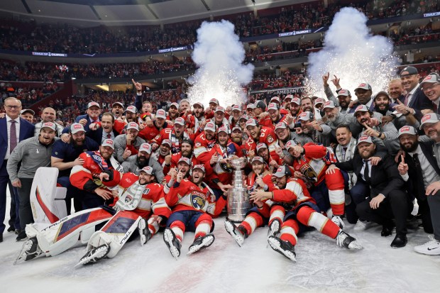 Players from the Florida Panthers pose for a photo after...