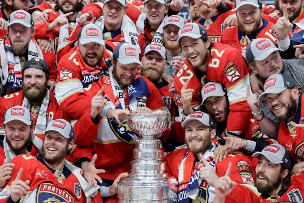 Players from the Florida Panthers pose for a photo after...
