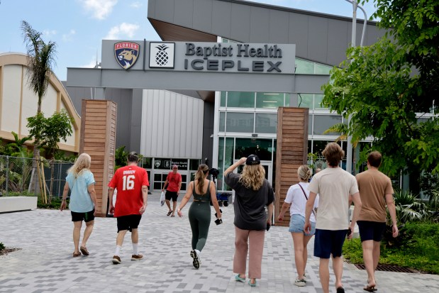 Panther fans rush to get Panther's merchandise at the Baptist Health IcePlex in Fort Lauderdale on Tuesday, June 25, 2024. The Panthers won the team's first Stanley Cup over Oilers. (Carline Jean/South Florida Sun Sentinel)