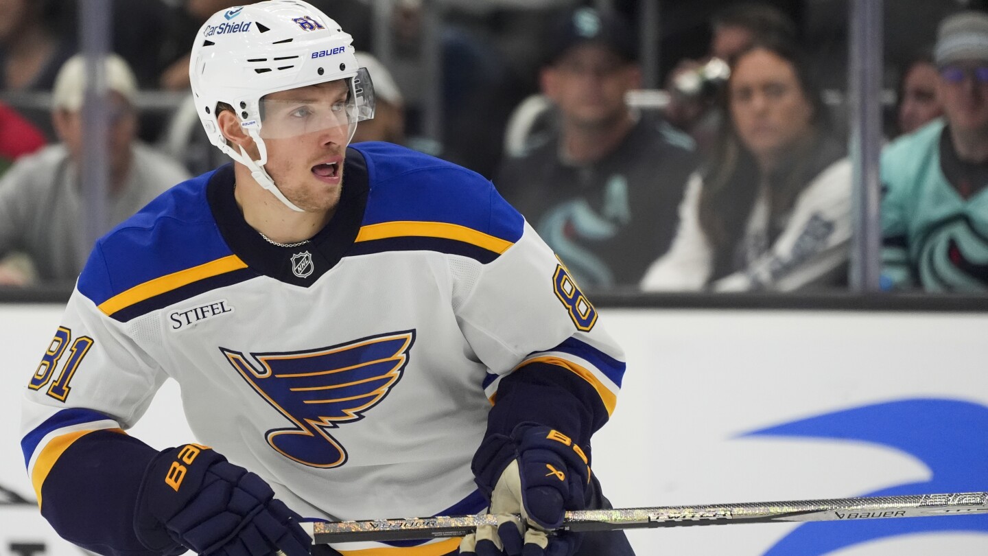 Blues forward Dylan Holloway taken to the hospital after being struck in neck by puck