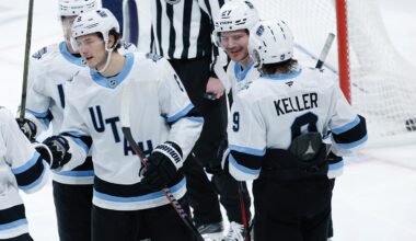 Jan 24, 2025; Winnipeg, Manitoba, CAN; Utah Hockey Club forward Barrett Hayton (27) is congratulated by his teammates on his goal against Winnipeg Jets goalie Connor Hellebuyck (37) during the third period at Canada Life Centre. Mandatory Credit: Terrence Lee-Imagn Images