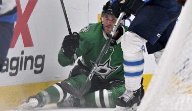 Apr 10, 2025; Dallas, Texas, USA; Dallas Stars right wing Mikko Rantanen (96) is taken down by Winnipeg Jets defenseman Dylan Samberg (54) during the second period at the American Airlines Center. Mandatory Credit: Jerome Miron-Imagn Images