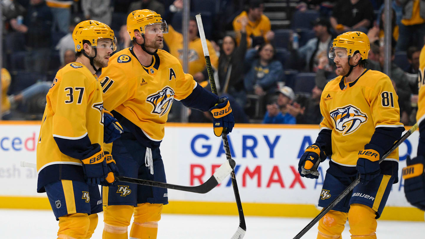 Apr 8, 2025; Nashville, Tennessee, USA;  Nashville Predators center Steven Stamkos (91) celebrates his goal with his teammates  against the New York Islanders during the third period at Bridgestone Arena. Mandatory Credit: Steve Roberts-Imagn Images