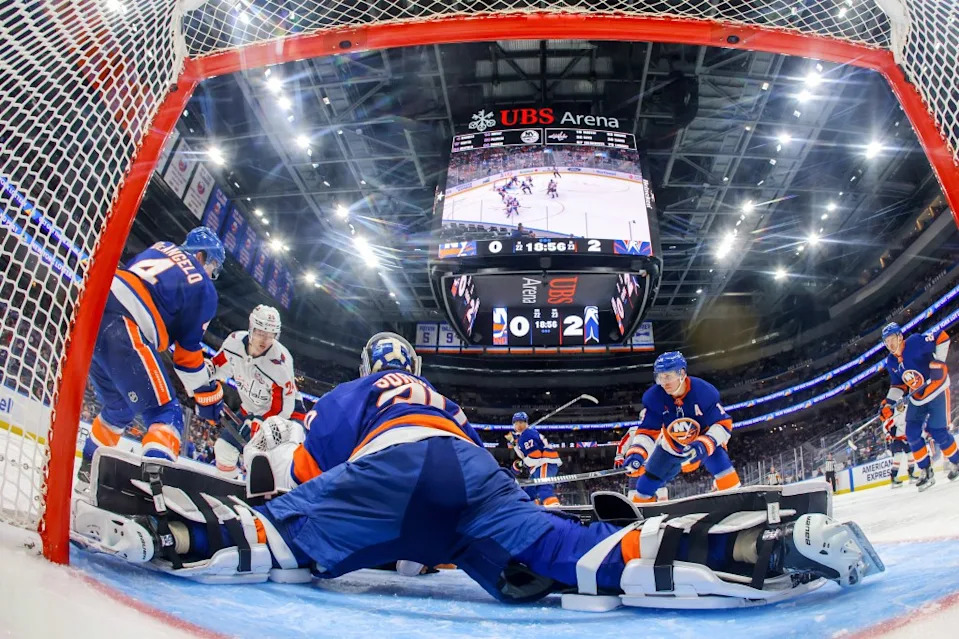 Ilya Sorokin of the New York Islanders makes a save against Connor McMichael #24 of the Washington Capitals during the third period at UBS Arena on April 15, 2025. NHLI via Getty Images