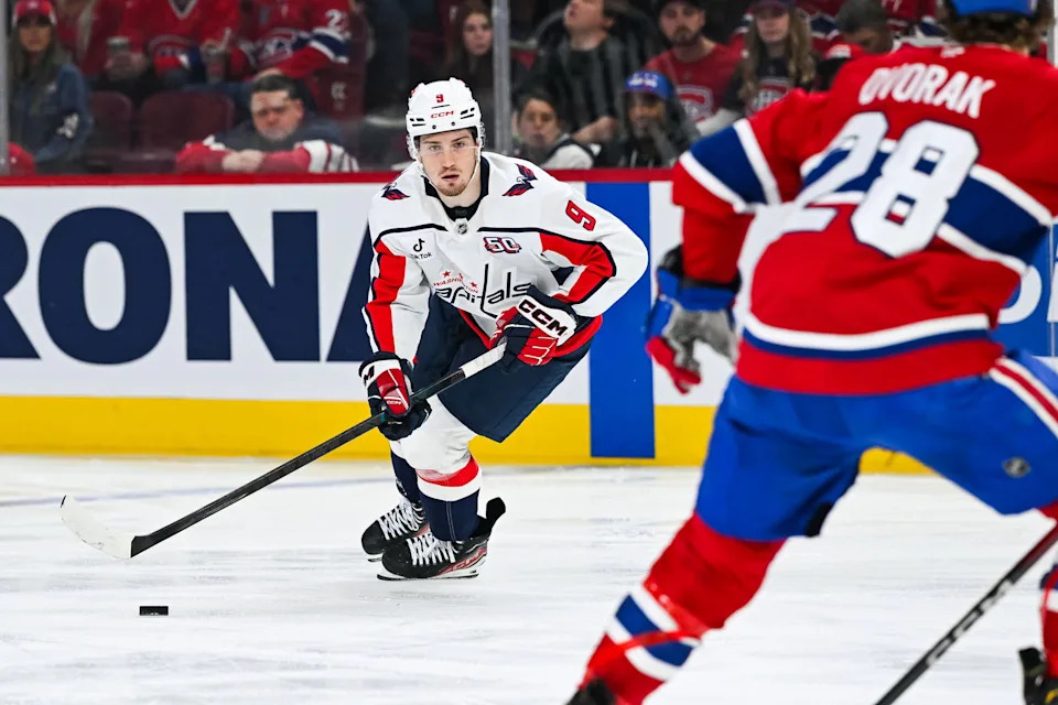 Apr 27, 2025; Montreal, Quebec, CAN; Washington Capitals right wing Ryan Leonard (9) plays the puck against the Montreal Canadiens  during the second period in game four of the first round of the 2025 Stanley Cup Playoffs at Bell Centre. Mandatory Credit: David Kirouac-Imagn Images