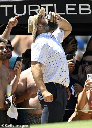 Jason Kelce shotguns a drink