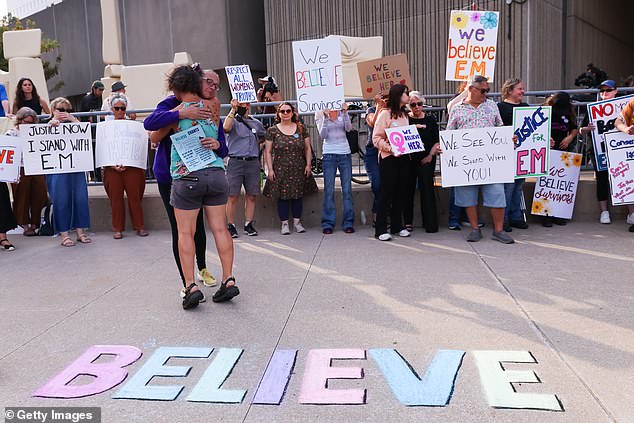 Supporters for 'E.M' gather outside a London Courthouse, in London, Ontario on Thursday