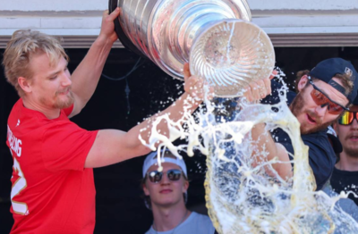 Aaron Ekblad, Seth Jones, and Gustav Forsling celebrate the Stanley Cup moment at the Coldplay Show