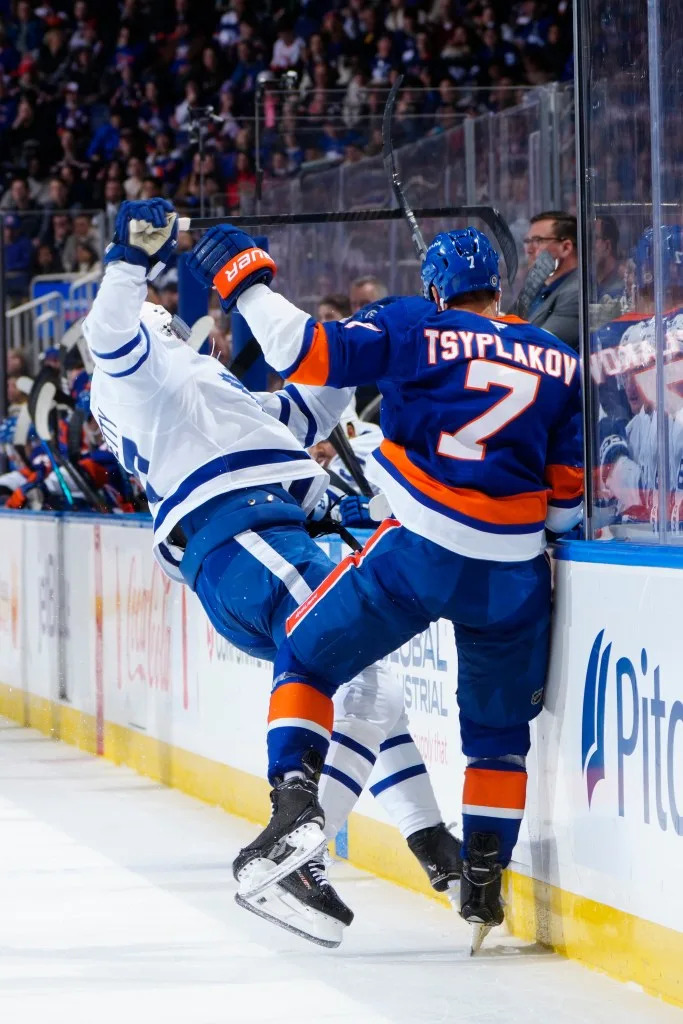 Max Pacioretty #67 of the Toronto Maple Leafs collides with Maxim Tsyplakov #7 of the New York Islanders during the second period at UBS Arena on January 02, 2025 in Elmont, New York. NHLI via Getty Images
