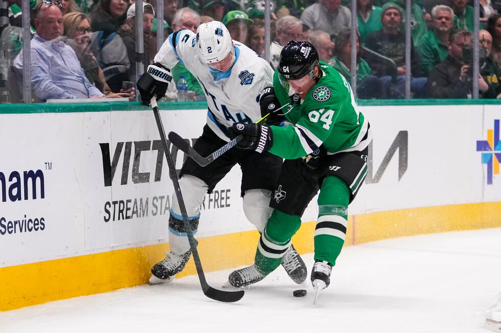 Utah Hockey Club defenseman Olli Määttä (2) and Dallas Stars center Mikael Granlund (64)...