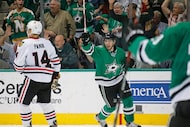 Dallas Stars left wing Curtis McKenzie (11) celebrates his first period goal during the...