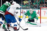 Dallas Stars goaltender Jake Oettinger (29) stops a Colorado Avalanche shot during the...