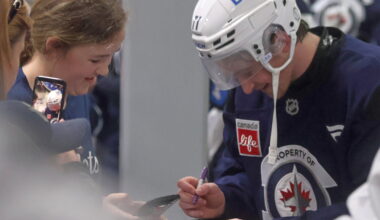 Winnipeg Jets third round draft pick Owen Martin signs autographs for kids after the end of the team