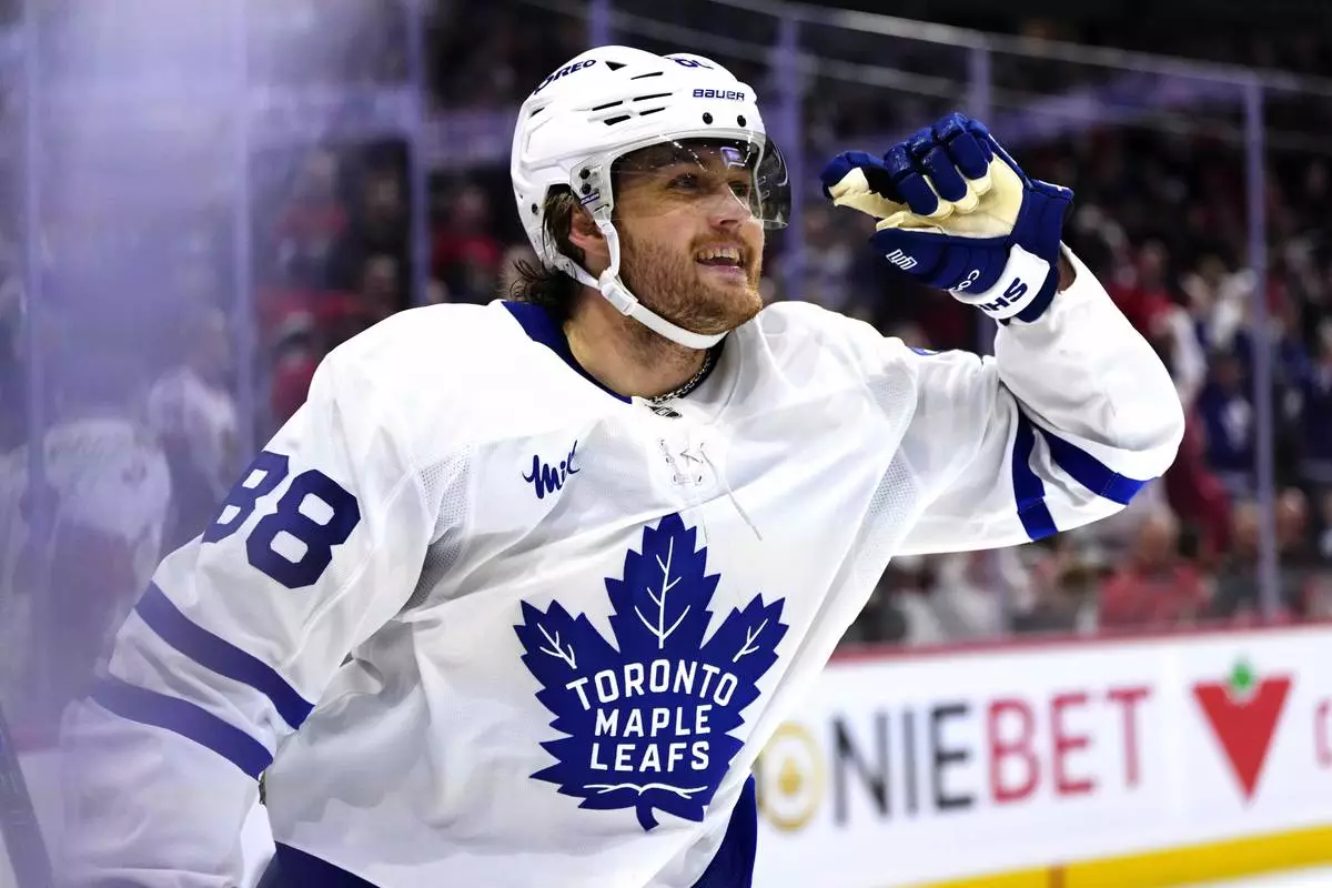 Toronto Maple Leafs' William Nylander (88) reacts after scoring an empty-net goal against the Ottawa Senators during the third period of Game 6 of a first-round NHL hockey playoff series in Ottawa, Ontario, Thursday, May 1, 2025. (Justin Tang/The Canadian Press via AP)