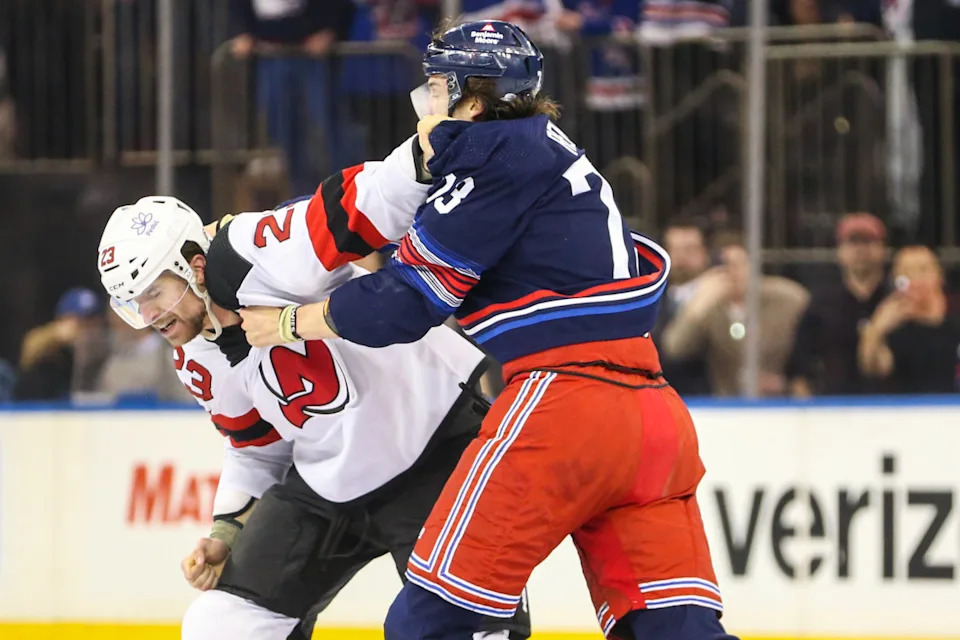 New York Rangers center Matt Rempe, right, and New Jersey Devils defenseman Kurtis MacDermid fight at Madison Square Garden.Wendell Cruz-USA TODAY Sports