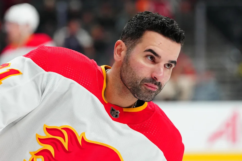Calgary Flames center Nazem Kadri (91) warms up.Stephen R&period; Sylvanie-USA TODAY Sports via Imagn Images