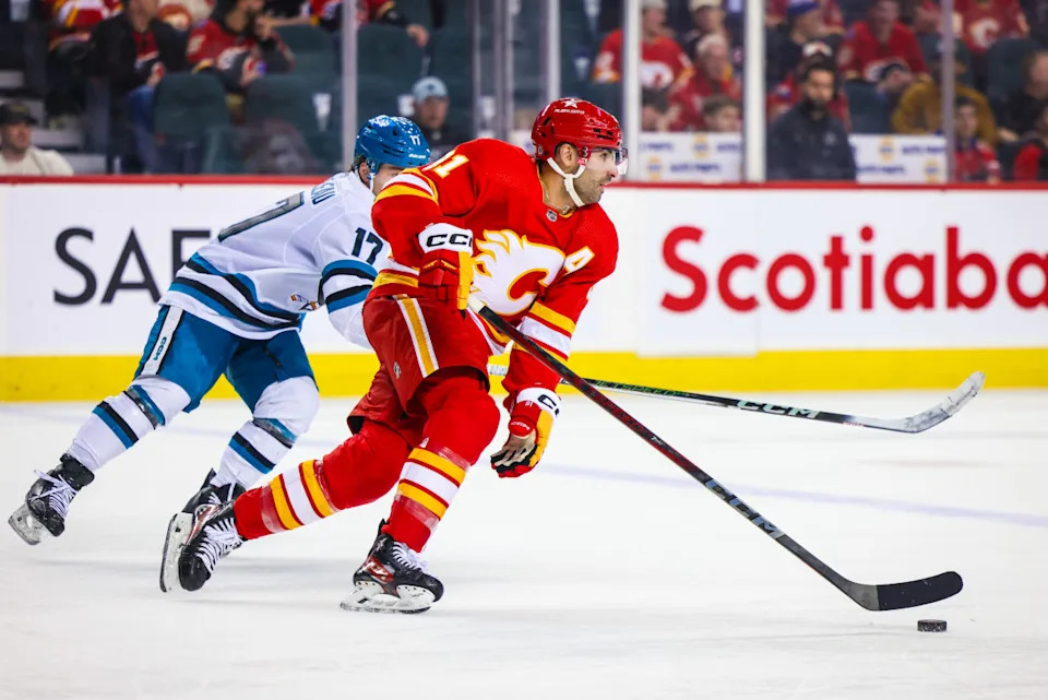 Calgary Flames center Nazem Kadri (91) skates with the puck.Sergei Belski-Imagn Images