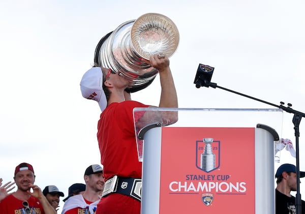 Florida Panthers' Matthew Tkachuk kisses the Stanley Cup during the NHL hockey team's Stanley Cup championship celebration, Sunday, June 22, 2025, in Fort Lauderdale, Fla. (AP Photo/Michael Laughlin)