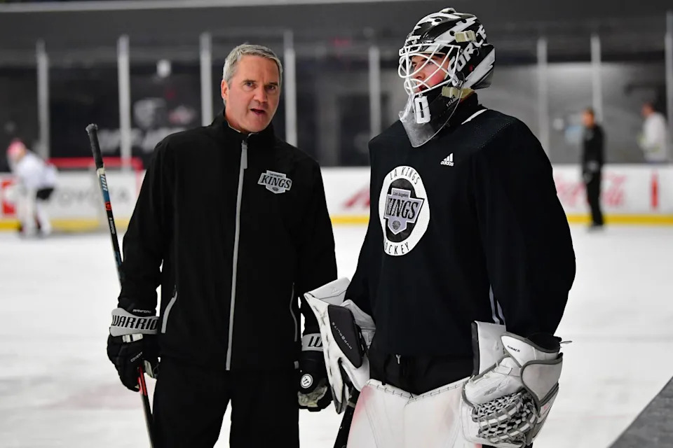 Bill Ranford, the Kings' director of goaltending, speaks with Kings prospect Hampton Slukynsky during development camp.