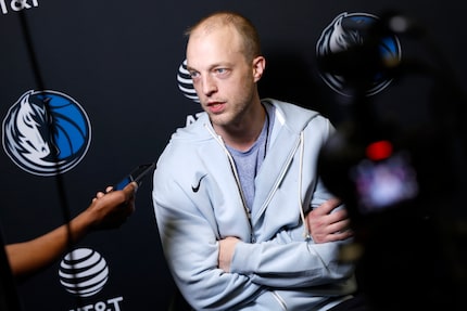 Dallas Mavericks summer league coach Josh Broghamer is interviewed by the media following...