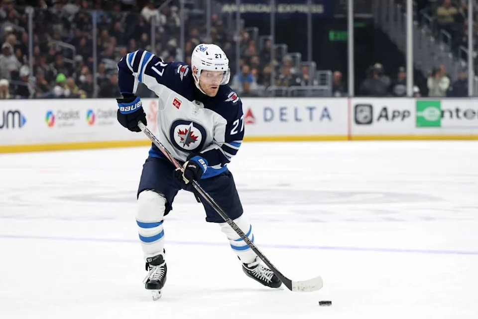 Apr 1, 2025; Los Angeles, California, USA; Winnipeg Jets left wing Nikolaj Ehlers (27) skates with the puck during the third period against the Los Angeles Kings at Crypto.com Arena.