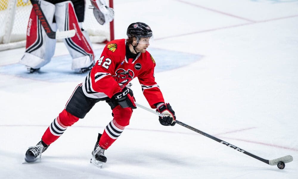 Chicago Blackhawks Prospect Nolan Allan skates with the puck during a game with the Rockford IceHogs.