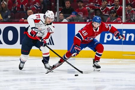 Apr 27, 2025; Montreal, Quebec, CAN; Washington Capitals left wing Anthony Beauvillier (72) plays the puck against Montreal Canadiens defenseman Lane Hutson (48) during the second period in game four of the first round of the 2025 Stanley Cup Playoffs at Bell Centre. Mandatory Credit: David Kirouac-Imagn Images Apr 27, 2025; Montreal, Quebec, CAN; Washington Capitals left wing Anthony Beauvillier (72) plays the puck against Montreal Canadiens defenseman Lane Hutson (48) during the second period in game four of the first round of the 2025 Stanley Cup Playoffs at Bell Centre. Mandatory Credit: David Kirouac-Imagn Images