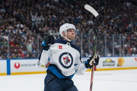 Mar 18, 2025; Vancouver, British Columbia, CAN; Winnipeg Jets forward Nikolaj Ehlers (27) celebrates his goal against the Vancouver Canucks in the first period at Rogers Arena. Mandatory Credit: Bob Frid-Imagn Images