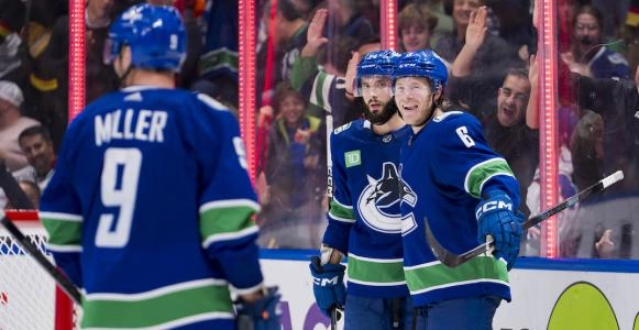 Former Vancouver Canucks forward Phil Di Giuseppe, J.T. Miller and current winger Brock Boeser.