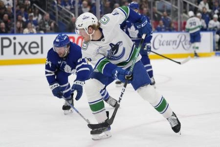 Vancouver Canucks forward Brock Boeser making a move around Toronto Maple Leafs defenseman Morgan Rielly. Vancouver Canucks forward Brock Boeser making a move around Toronto Maple Leafs defenseman Morgan Rielly.