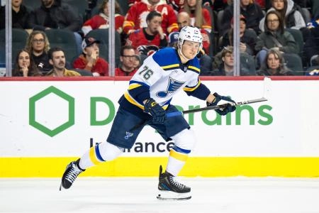 Dec 5, 2024; Calgary, Alberta, CAN; St. Louis Blues center Zachary Bolduc (76) skates against the Calgary Flames during the first period at Scotiabank Saddledome. Mandatory Credit: Brett Holmes-Imagn Images