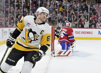 Dec 13, 2023; Montreal, Quebec, CAN; Pittsburgh Penguins forward Sidney Crosby (87) scores a goal against Montreal Canadiens goalie Sam Montembeault (35) during the shootout period at the Bell Centre. Mandatory Credit: Eric Bolte-Imagn Images Dec 13, 2023; Montreal, Quebec, CAN; Pittsburgh Penguins forward Sidney Crosby (87) scores a goal against Montreal Canadiens goalie Sam Montembeault (35) during the shootout period at the Bell Centre. Mandatory Credit: Eric Bolte-Imagn Images