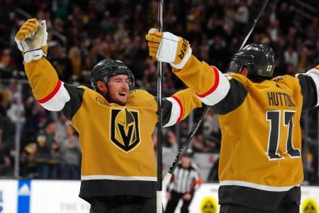 Mar 23, 2024; Las Vegas, Nevada, USA; Vegas Golden Knights center Ivan Barbashev (49) celebrates with Vegas Golden Knights defenseman Ben Hutton (17) after scoring a goal against the Columbus Blue Jackets during the second period at T-Mobile Arena. Mandatory Credit: Stephen R. Sylvanie-Imagn Images