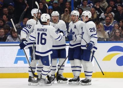 Mitch Marner celebrating with the rest of his teammates after John Tavares scored a goal.