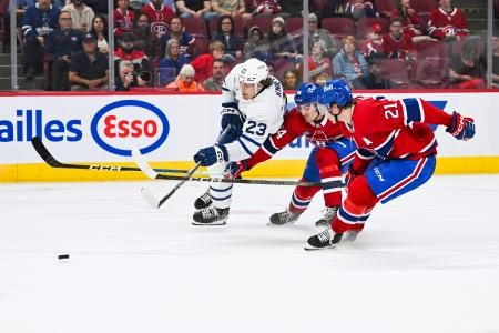 Sep 30, 2023; Montreal, Quebec, CAN; Montreal Canadiens defenseman William Trudeau (84) and defenseman Kaiden Guhle (21) defend the puck against Toronto Maple Leafs left wing Matthew Knies (23) during the first period at Bell Centre. Mandatory Credit: David Kirouac-Imagn Images Sep 30, 2023; Montreal, Quebec, CAN; Montreal Canadiens defenseman William Trudeau (84) and defenseman Kaiden Guhle (21) defend the puck against Toronto Maple Leafs left wing Matthew Knies (23) during the first period at Bell Centre. Mandatory Credit: David Kirouac-Imagn Images