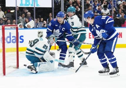 San Jose Sharks defenseman Henry Thrun trying to protect the crease against the Toronto Maple Leafs.