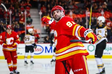 Dec 17, 2024; Calgary, Alberta, CAN; Calgary Flames center Nazem Kadri (91) celebrates his goal against the Boston Bruins during the second period at Scotiabank Saddledome. Mandatory Credit: Sergei Belski-Imagn Images
