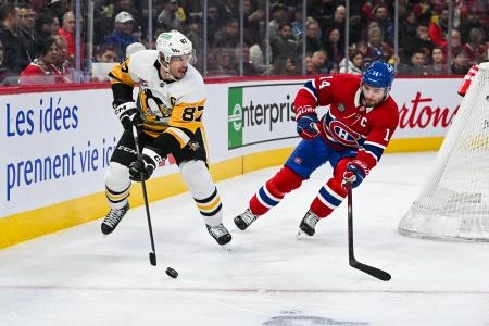 Dec 12, 2024; Montreal, Quebec, CAN; Pittsburgh Penguins center Sidney Crosby (87) plays the puck against Montreal Canadiens center Nick Suzuki (14) during the third period at Bell Centre. Mandatory Credit: David Kirouac-Imagn Images Dec 12, 2024; Montreal, Quebec, CAN; Pittsburgh Penguins center Sidney Crosby (87) plays the puck against Montreal Canadiens center Nick Suzuki (14) during the third period at Bell Centre. Mandatory Credit: David Kirouac-Imagn Images