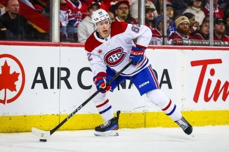 Mar 8, 2025; Calgary, Alberta, CAN; Montreal Canadiens center Owen Beck (62) skates with the puck against the Calgary Flames during the third period at Scotiabank Saddledome. Mandatory Credit: Sergei Belski-Imagn Images