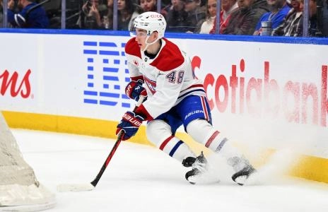Apr 12, 2025; Toronto, Ontario, CAN; Montreal Canadiens defenseman Lane Hutson (48) turns behind his goal against the Toronto Maple Leafs in the first period at Scotiabank Arena. Mandatory Credit: Dan Hamilton-Imagn Images
