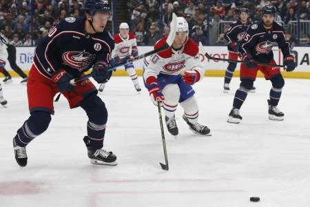 Dec 23, 2024; Columbus, Ohio, USA; Columbus Blue Jackets left wing Dmitri Voronkov (10) and Montreal Canadiens left wing Juraj Slafkovsky (20) chase down a loose puck during the first period at Nationwide Arena. Mandatory Credit: Russell LaBounty-Imagn Images Dec 23, 2024; Columbus, Ohio, USA; Columbus Blue Jackets left wing Dmitri Voronkov (10) and Montreal Canadiens left wing Juraj Slafkovsky (20) chase down a loose puck during the first period at Nationwide Arena. Mandatory Credit: Russell LaBounty-Imagn Images