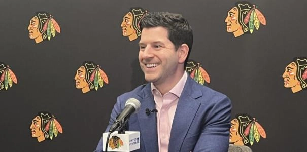 Chicago Blackhawks GM Kyle Davidson smiles as he speaks to the media Chicago Blackhawks GM Kyle Davidson smiles as he speaks to the media