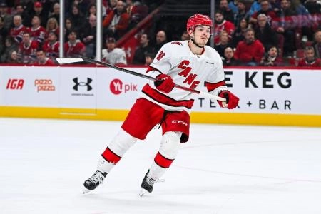 Apr 16, 2025; Montreal, Quebec, CAN; Carolina Hurricanes center Jack Roslovic (96) skates against the Montreal Canadiens in the second period at Bell Centre. Mandatory Credit: David Kirouac-Imagn Images