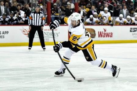Apr 11, 2025; Newark, New Jersey, USA; Pittsburgh Penguins defenseman Matt Grzelcyk (24) shoots the puck during the first period against the New Jersey Devils at Prudential Center. Mandatory Credit: John Jones-Imagn Images Apr 11, 2025; Newark, New Jersey, USA; Pittsburgh Penguins defenseman Matt Grzelcyk (24) shoots the puck during the first period against the New Jersey Devils at Prudential Center. Mandatory Credit: John Jones-Imagn Images