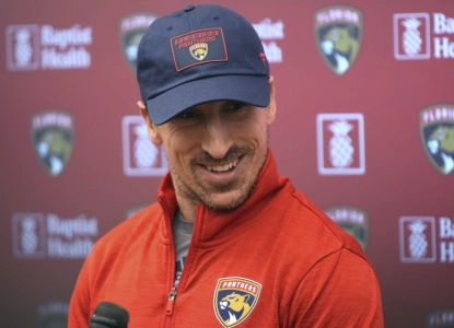 Florida Panthers' Brad Marchand smiles as he speaks to reporters